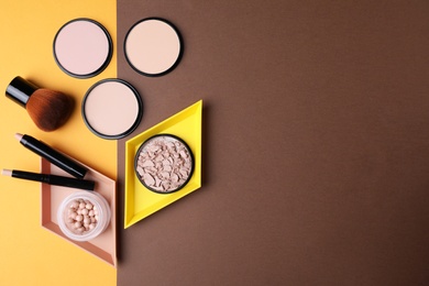 Flat lay composition with various makeup products on color background. Space for text