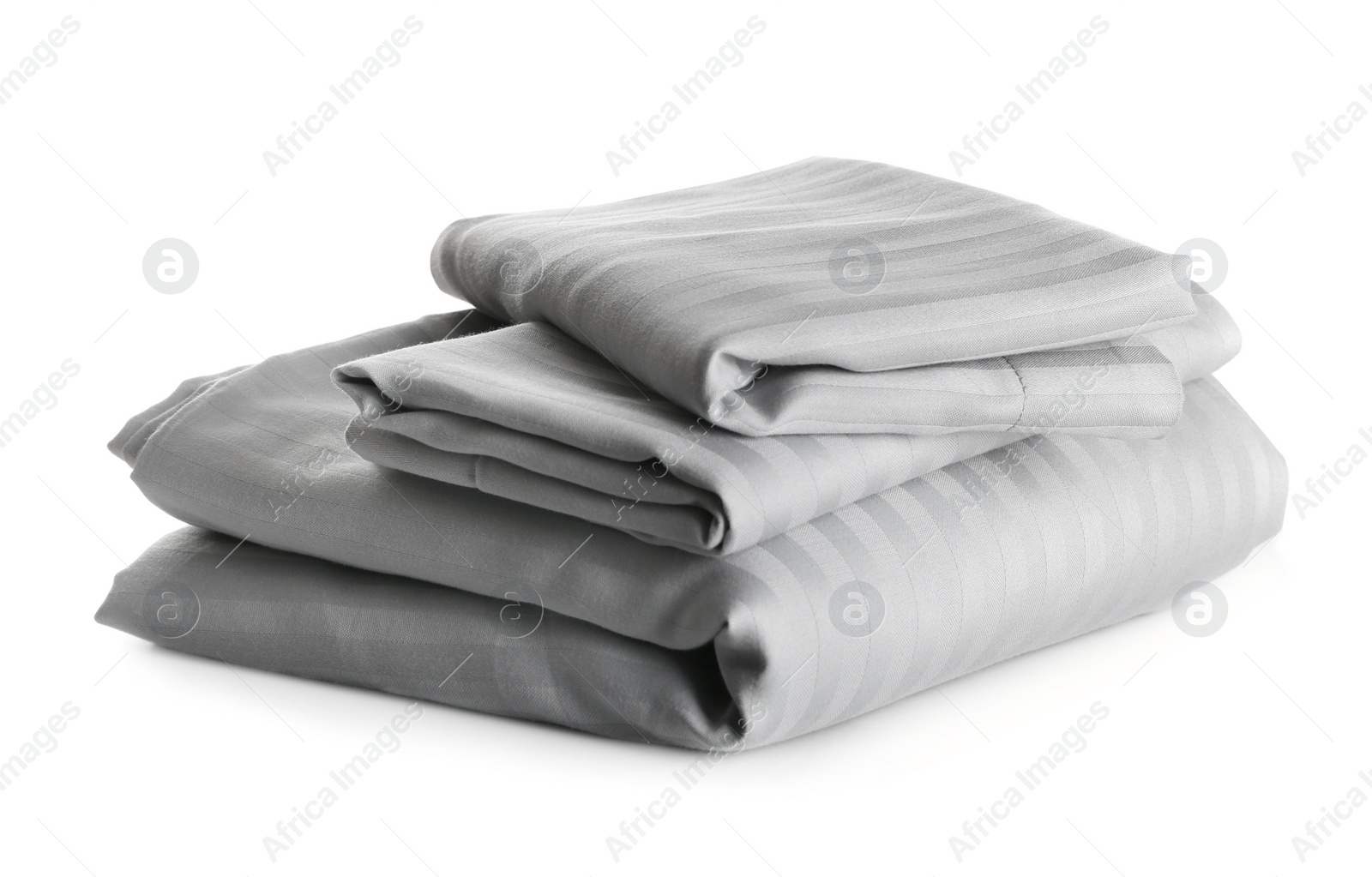 Photo of Stack of clean bed sheets isolated on white