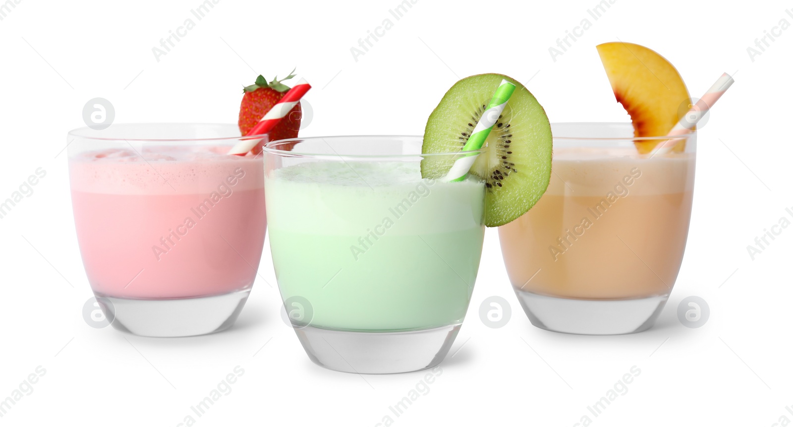 Photo of Glasses of tasty milk shakes on white background