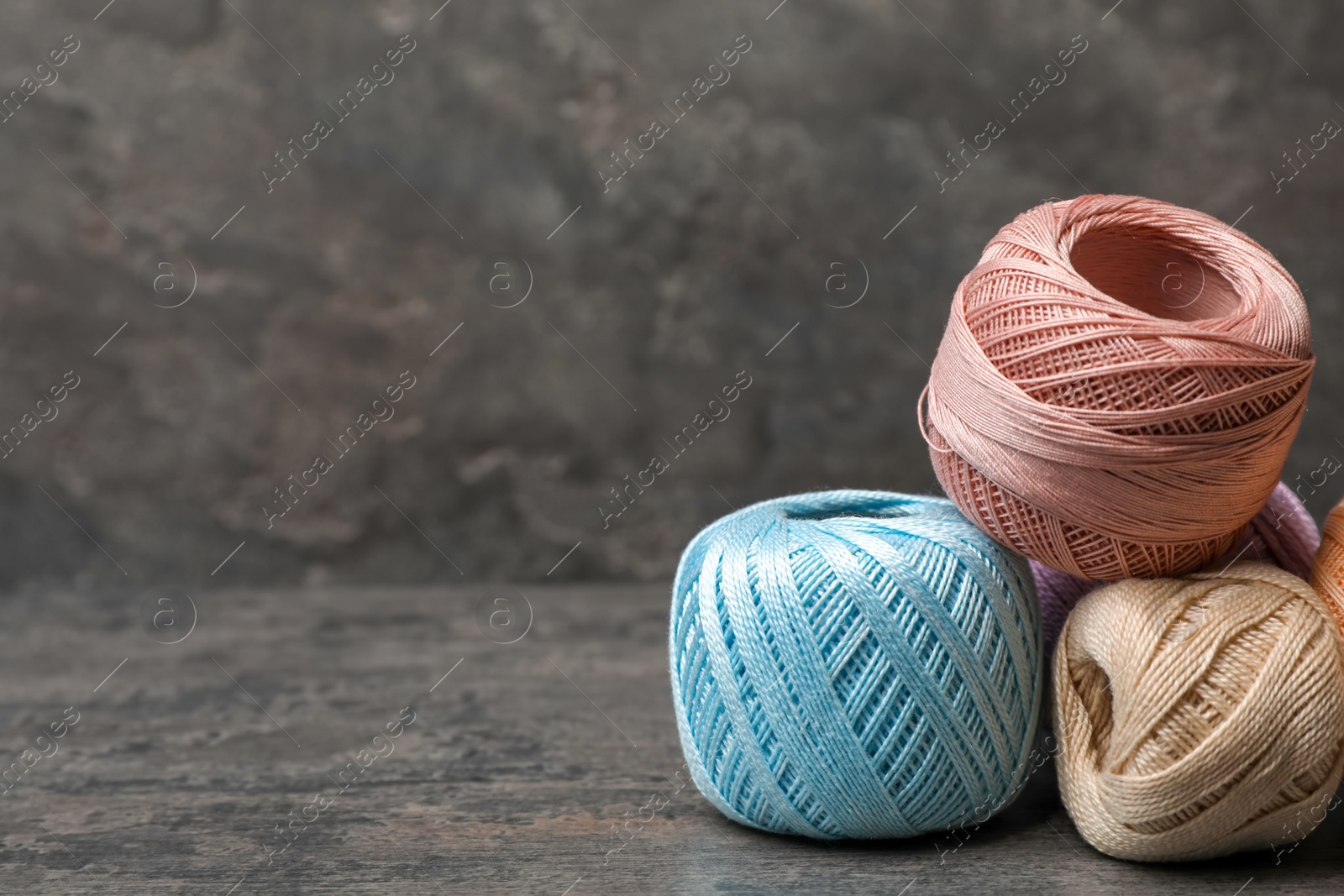 Photo of Color threads on gray background