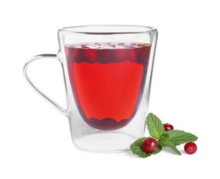 Photo of Tasty hot cranberry tea with mint in glass cup on white background