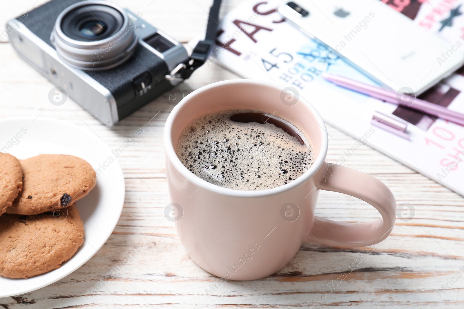 Photo of Cup of delicious hot coffee on table