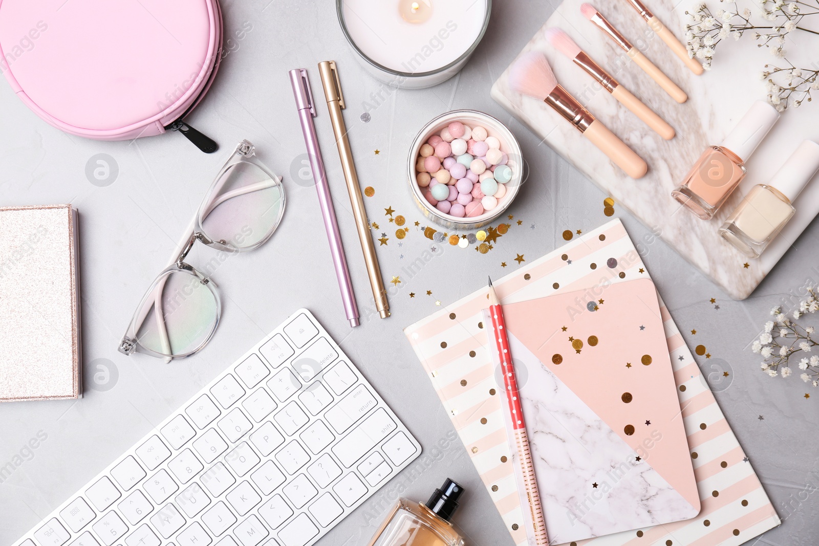 Photo of Set of accessories, cosmetics and computer keyboard on grey background, flat lay