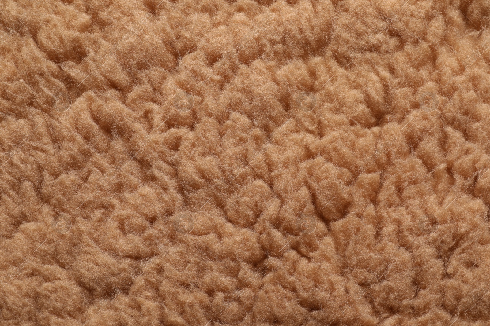 Photo of Texture of brown faux fur as background, closeup