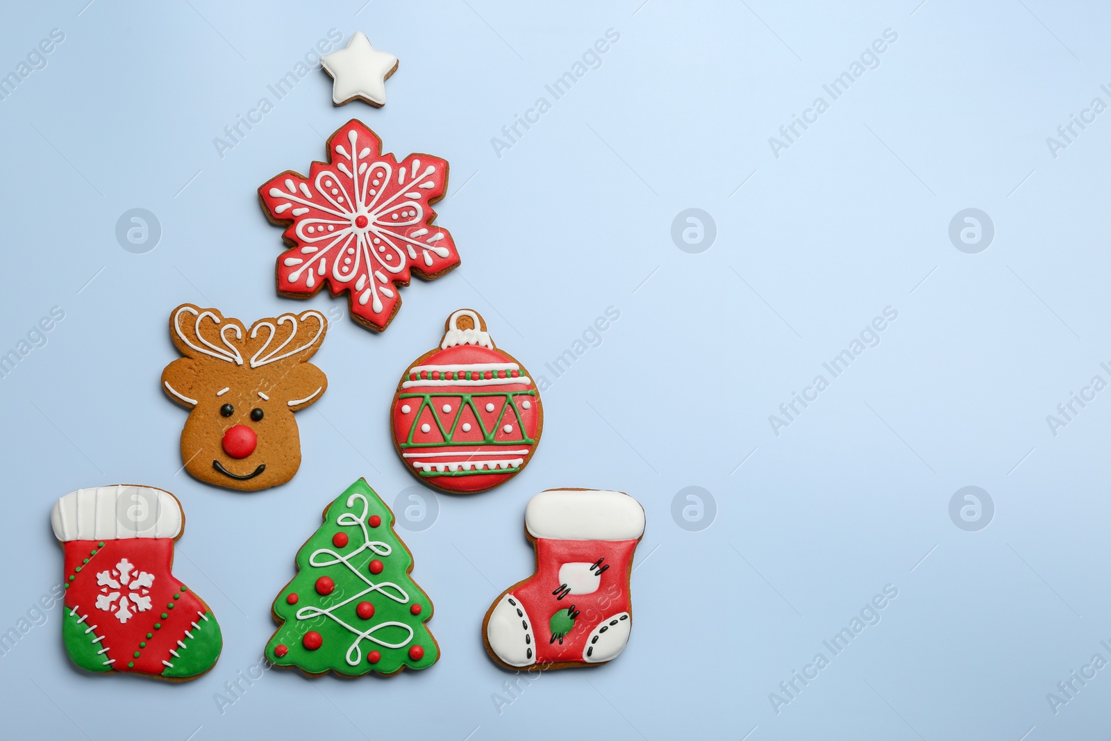 Photo of Different tasty Christmas cookies on light background, flat lay. Space for text