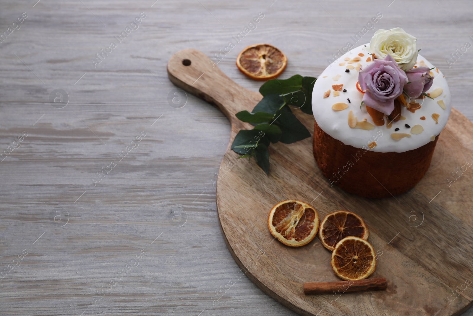 Photo of Traditional decorated Easter cake on wooden table. Space for text