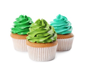 Different delicious colorful cupcakes on white background