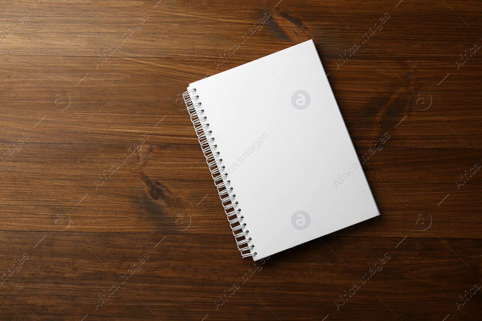 Photo of Blank paper brochure on wooden table, top view. Mockup for design