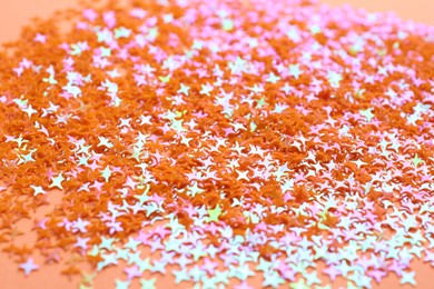 Photo of Shiny bright glitter as background, closeup view