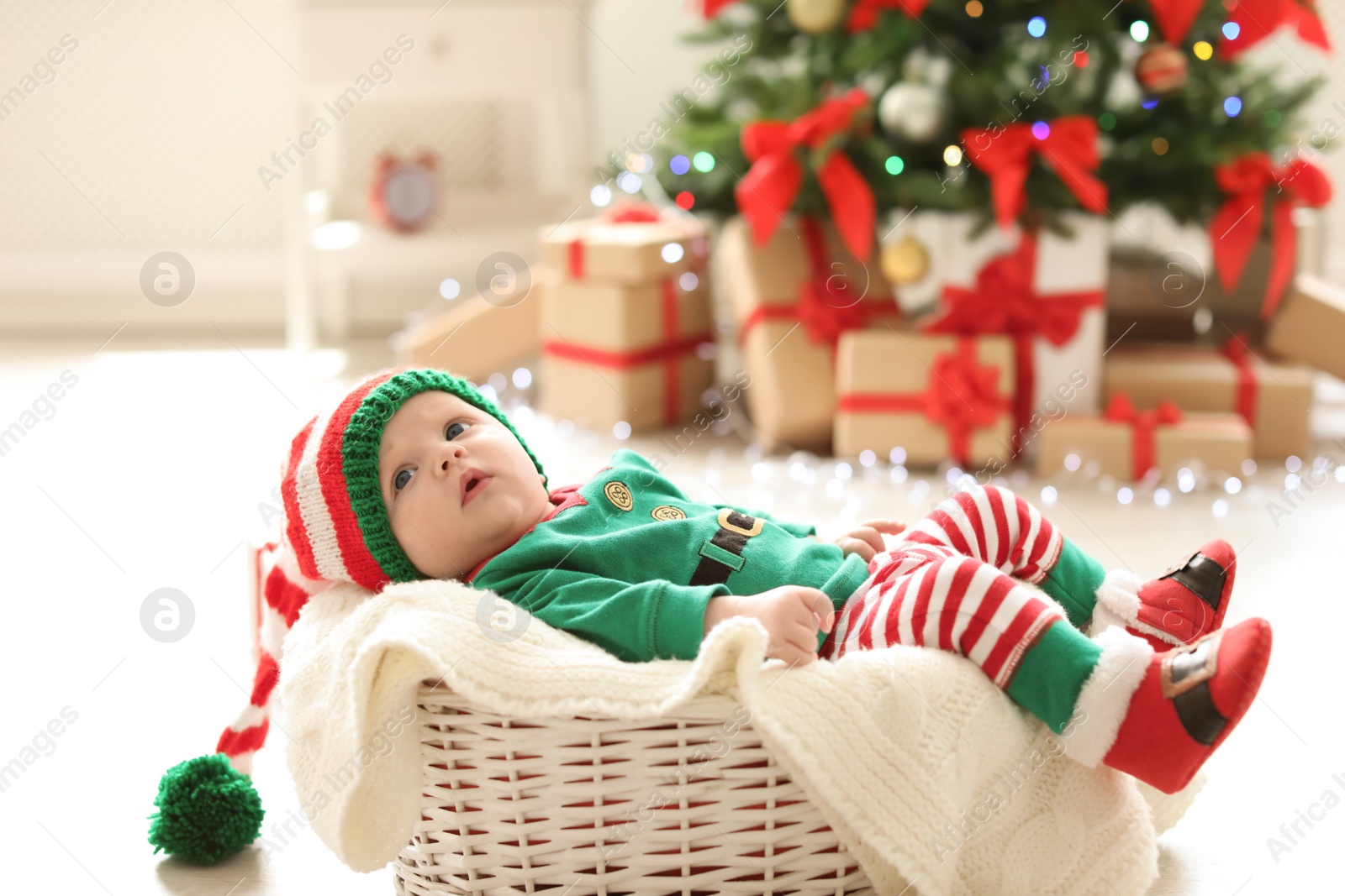 Photo of Cute baby in Christmas costume at home