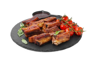 Photo of Tasty roasted pork ribs, basil, sauce and tomatoes isolated on white