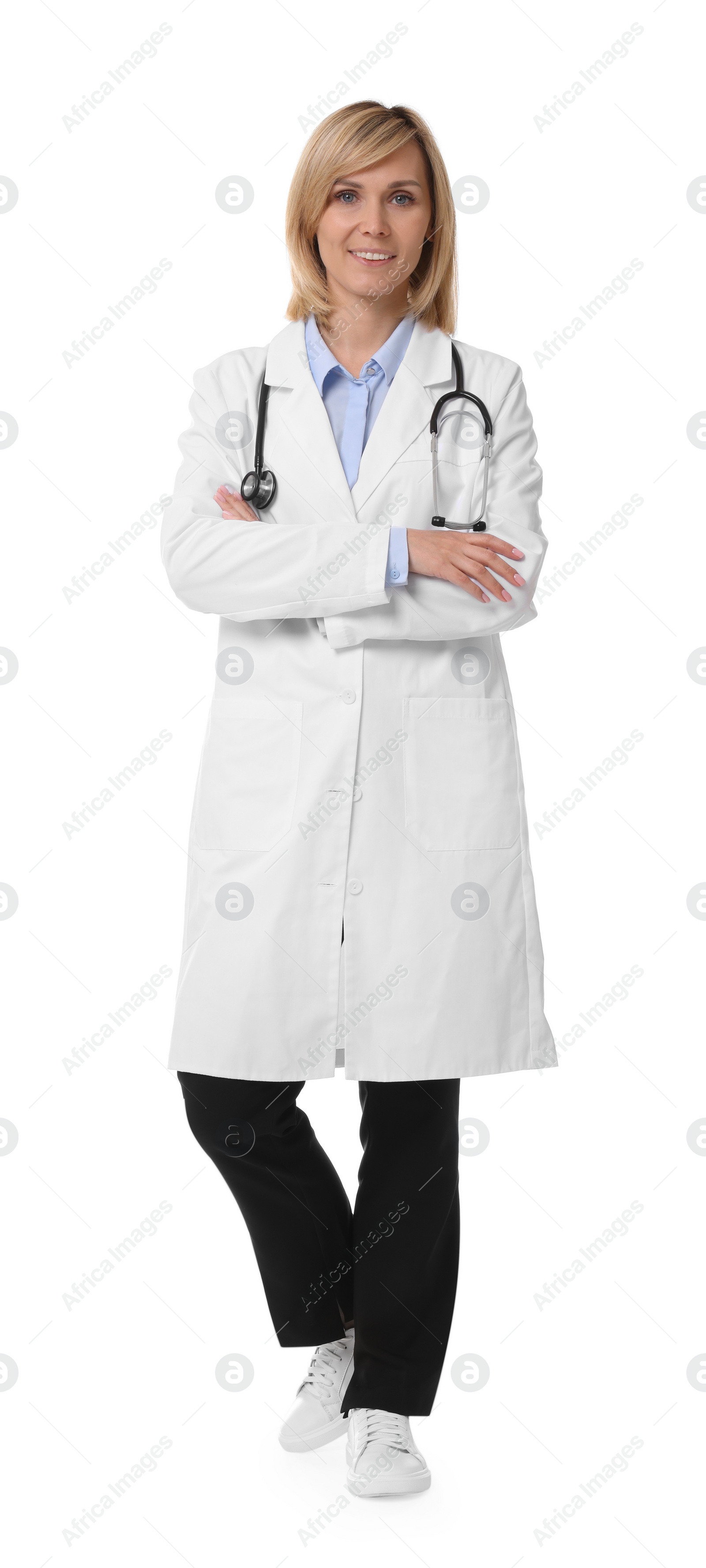 Photo of Smiling doctor with crossed arms on white background