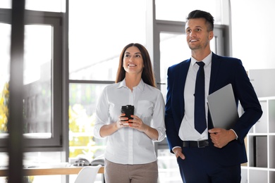 Portrait of business trainers in office wear at workplace