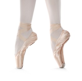 Ballerina in pointe shoes dancing on white background, closeup