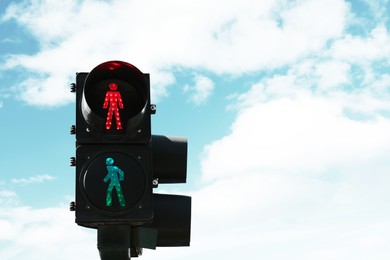 Photo of Traffic lights with red sign against blue sky, space for text. Road rules