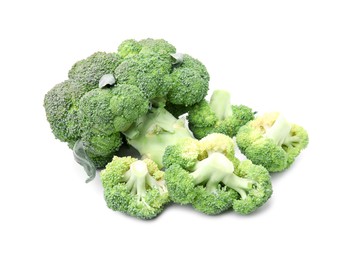 Photo of Pile of fresh raw green broccoli isolated on white