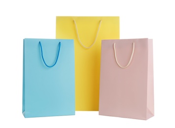 Photo of Different paper shopping bags isolated on white