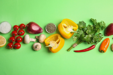 Photo of Flat lay composition with ingredients for cooking on green background