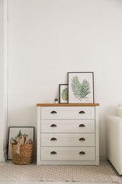 Modern chest of drawers in living room. Interior design