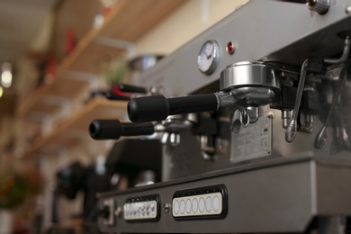 Photo of Modern electric coffee machine coffee machine with portafilters, closeup. Space for text
