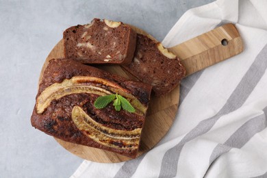 Photo of Delicious banana bread on grey table, top view