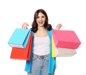 Photo of Beautiful young woman with paper shopping bags on white background