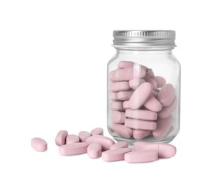 Photo of Bottle and pile of vitamin pills isolated on white