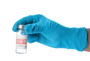 Photo of Doctor holding vial with vaccine against Covid-19 on white background, closeup