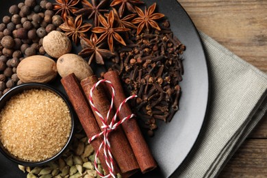 Photo of Dishware with different spices on table, top view