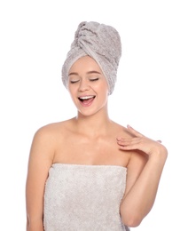 Photo of Portrait of young pretty woman with towels on white background