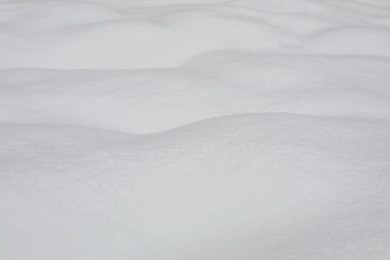 Photo of Beautiful white snow as background, closeup. Winter season