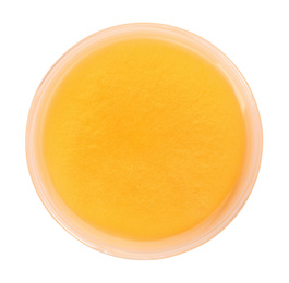 Photo of Orange slime in plastic container isolated on white, top view. Antistress toy