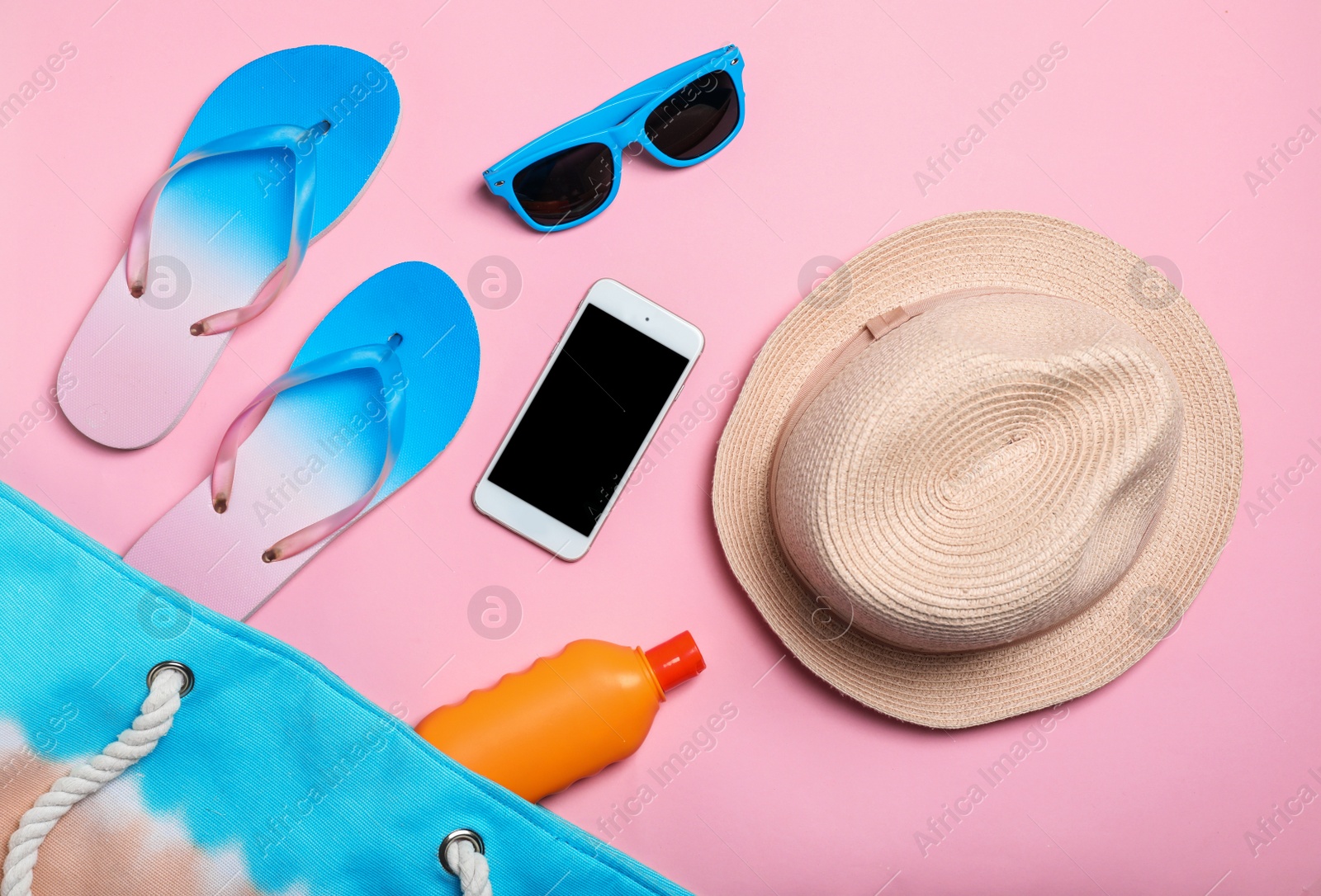 Photo of Flat lay composition with collection of beach objects on color background