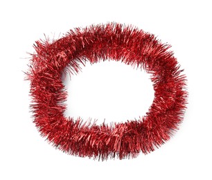 Photo of Shiny red tinsel isolated on white, top view
