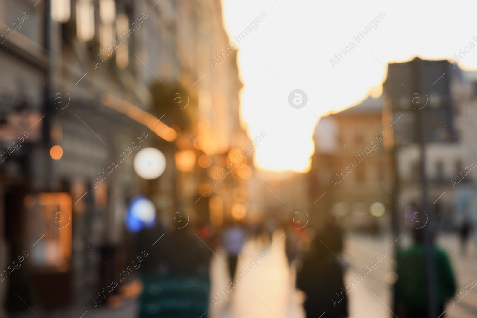 Photo of Blurred view of people walking on city street