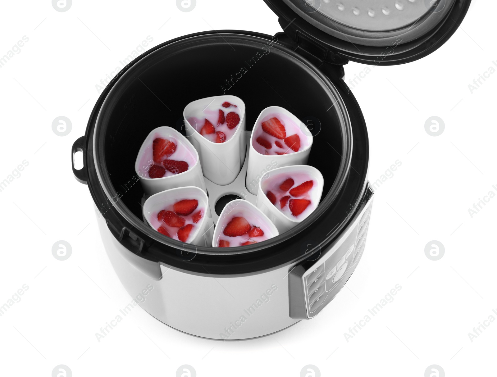 Photo of Open multi cooker with cups of homemade yogurt isolated on white