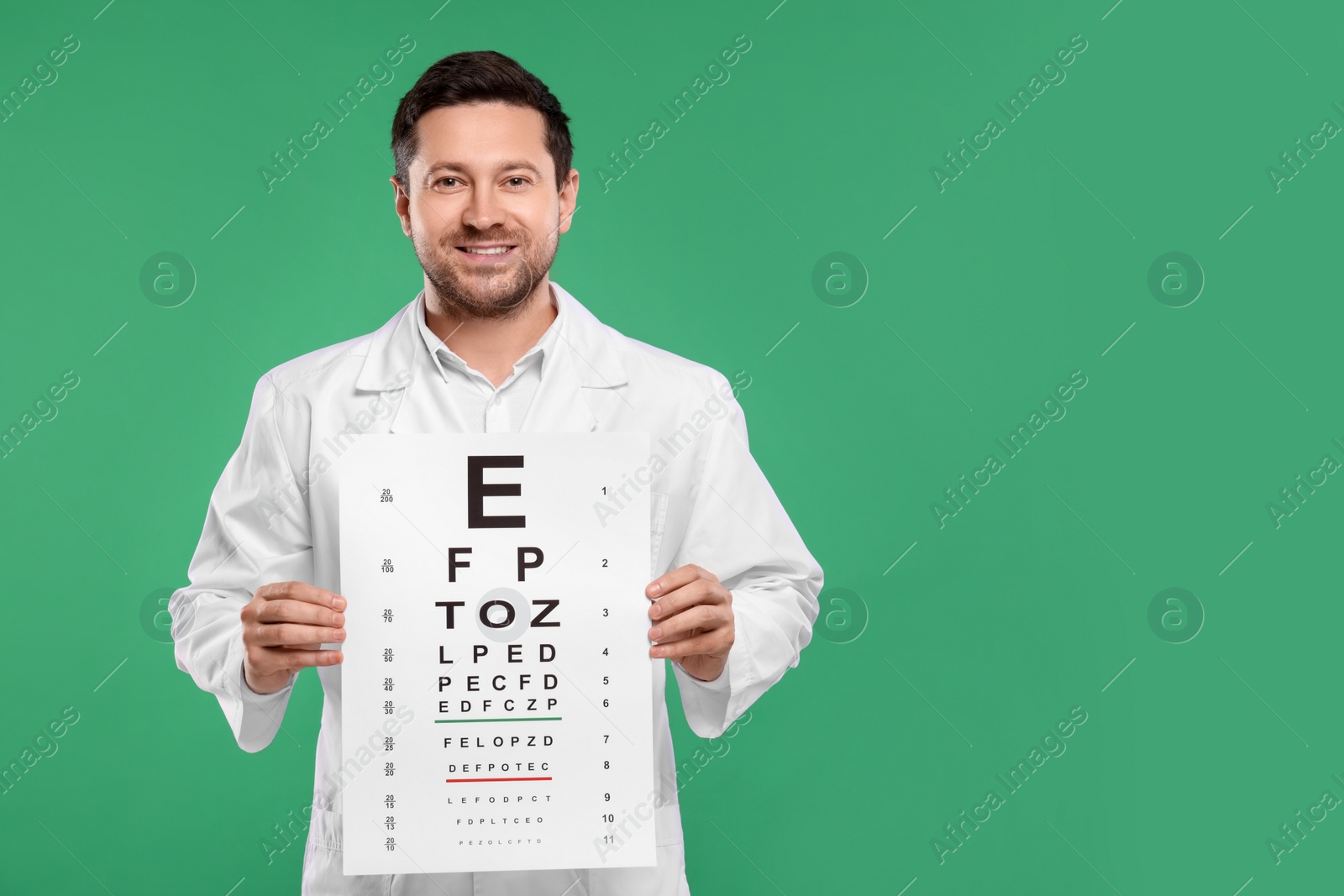 Photo of Ophthalmologist with vision test chart on green background, space for text