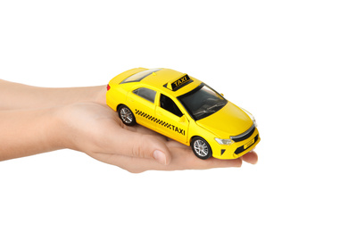 Photo of Woman with taxi car model on white background, closeup