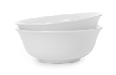 Photo of Clean bowls on white background. Washing dishes