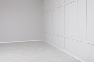 Photo of Empty room interior with white walls and floor