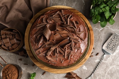 Flat lay composition with tasty chocolate cake on table