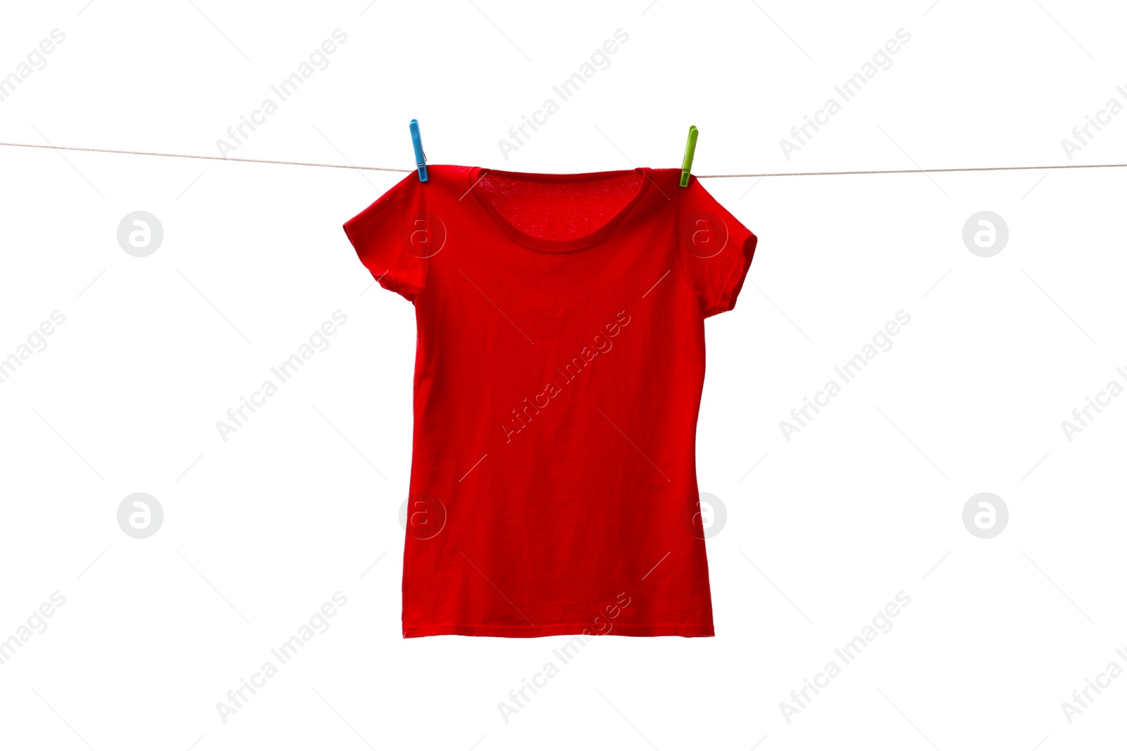 Photo of One red t-shirt drying on washing line isolated on white