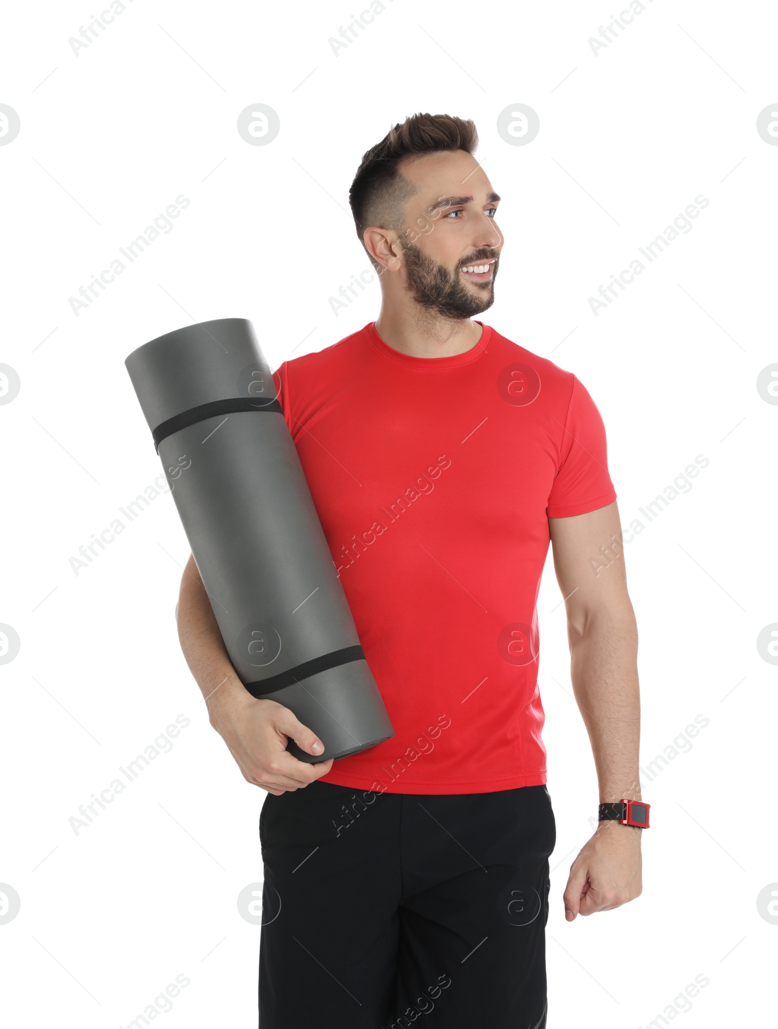 Photo of Handsome man with yoga mat on white background