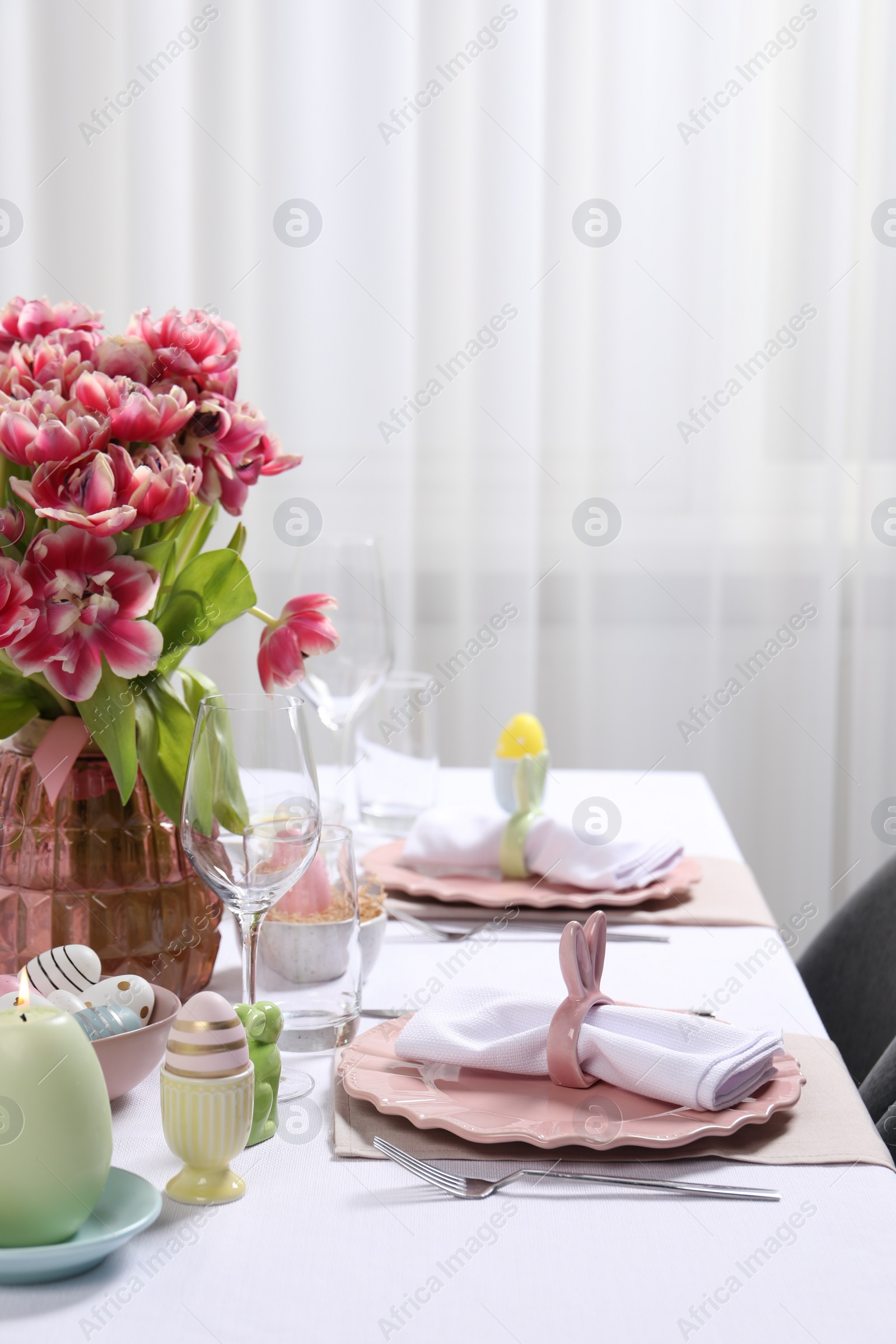 Photo of Festive table setting with beautiful flowers. Easter celebration