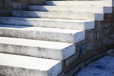 Photo of View of empty old concrete staircase outdoors on sunny day