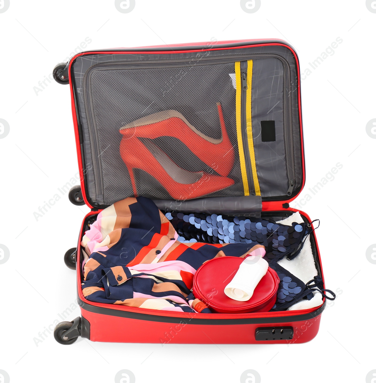 Photo of Packed suitcase with deodorant and clothes on white background