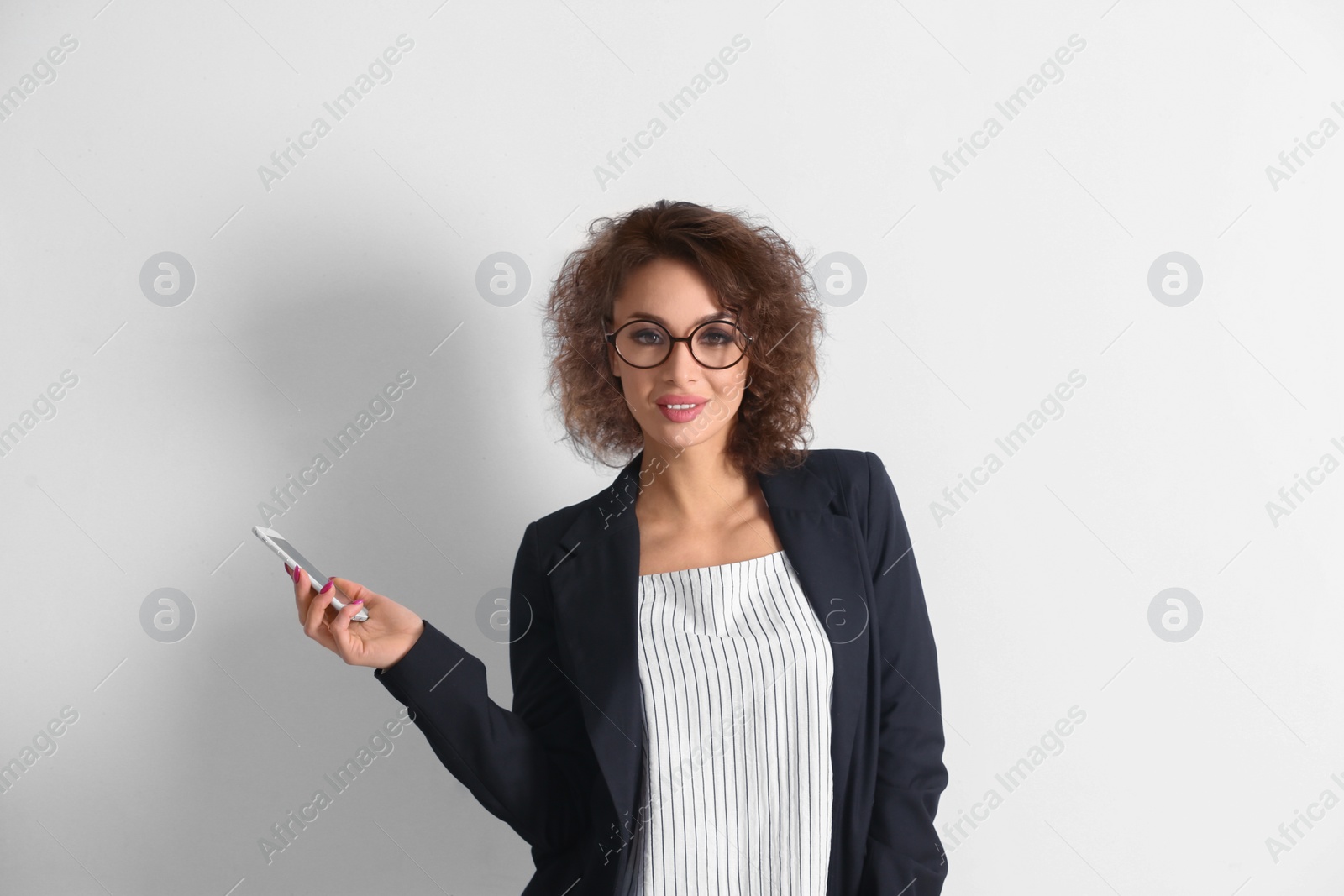 Photo of Beautiful woman using phone on white background