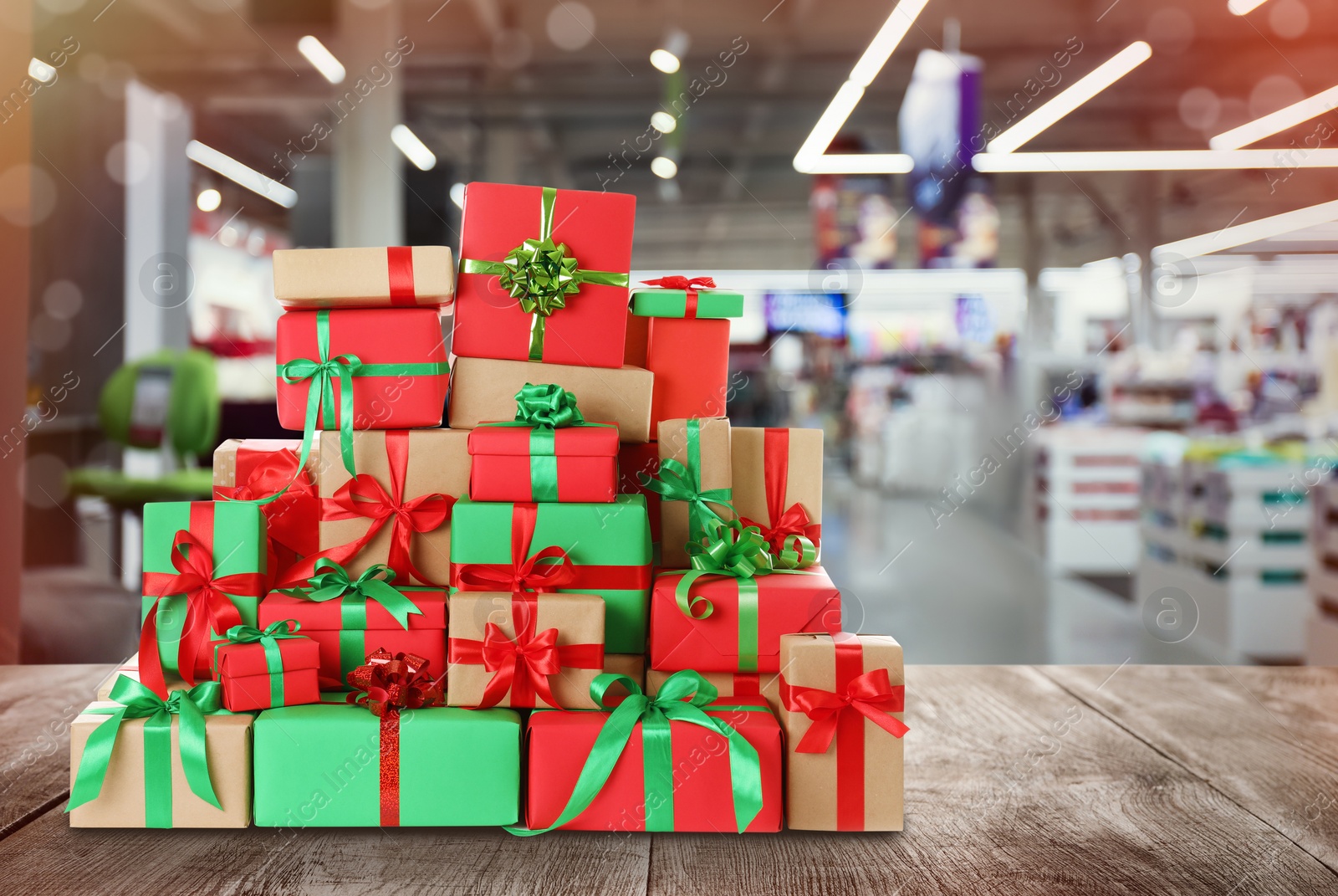 Image of Boxing day concept. Many gifts and blurred supermarket on background