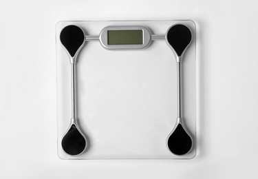 Photo of Bathroom scales on white background, top view. Weight loss concept