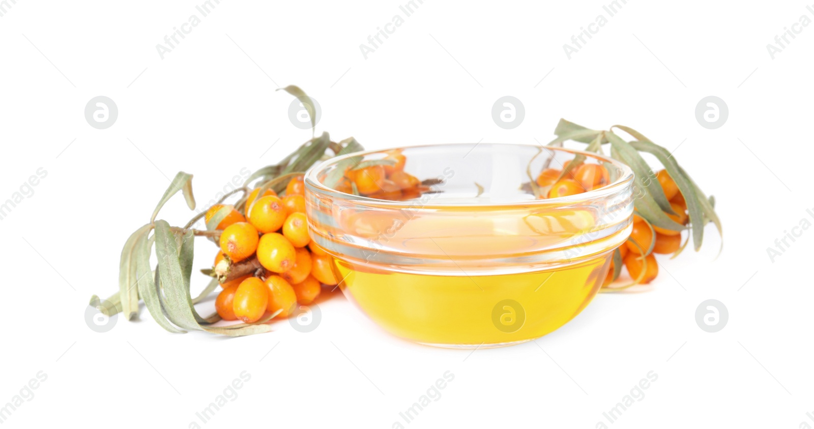 Photo of Natural sea buckthorn oil and fresh berries on white background